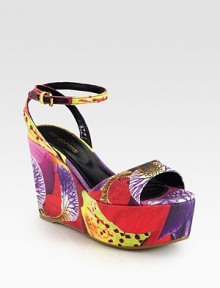 Vivacious floral-print canvas sandal in a platform wedge silhouette with a rubber sole and an adjustable ankle strap. Self-covered wedge, 4 (100mm)Covered platform, 2 (50mm)Compares to a 2 heel (50mm)Printed canvas upperLeather liningRubber solePadded insoleImportedOUR FIT MODEL RECOMMENDS ordering one half size up as this style runs small. 