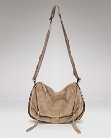 Mimicking vintage style with suede leather and front pouch pocket, this slouchy crossbody bag from Kooba indulges both your bohemian style and affinity for some luxury. Mimicking vintage style with suede leather and front pouch pocket, this slouchy crossbody bag from Kooba indulges both your bohemian style and affinity for some luxury.