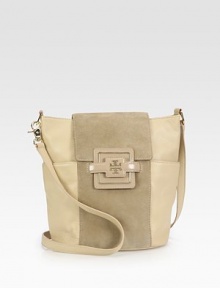 Supple pebbled leather accented with a center stripe of soft suede.Shoulder strap detaches on one side, 23 dropTop zip closure with slide flapTwo outside open pocketsOne inside zip pocketTwo inside open pocketsCanvas lining12½W X 10½H X 6DImported Supple pebbled leather accented with a center stripe of soft suede.Shoulder strap detaches on one side, 23 dropTop zip closure with slide flapTwo outside open pocketsOne inside zip pocketTwo inside open pocketsCanvas lining12½W X 10½H X 6DImported