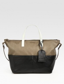 Blocks of rich matte leather add a touch of modernist-chic to this roomy carryall.Double top handles, 5¼ dropShoulder strap, 14 dropTop zip closureFour outside open pocketsProtective metal feetOne inside zip pocketOne inside open pocketFully lined12W X 10¼H X 7DMade in Italy Blocks of rich matte leather add a touch of modernist-chic to this roomy carryall.Double top handles, 5¼ dropShoulder strap, 14 dropTop zip closureFour outside open pocketsProtective metal feetOne inside zip pocketOne inside open pocketFully lined12W X 10¼H X 7DMade in Italy