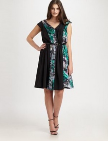 The best pairing of a wild print and solid color with a body-flattering, ruched bodice and a waist-complementing belt.V-neckCap sleevesRemovable beltSide zipperFully linedAbout 43 from shoulder to hem80% rayon/20% silkDry cleanImported