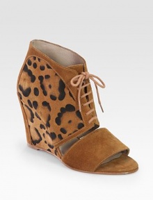 Lace-up suede confection with a unique leopard print and cutout front. Self-covered wedge, 3½ (90mm)Leopard-print suede upperLeather lining and solePadded insoleImported