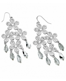 Flirty and fabulous, GUESS's four flower chandelier earrings shine with the addition of sparkling crystals and mirror beads. Set in silver tone mixed metal. Approximate drop: 3 inches. Approximate width: 1-3/4 inches.