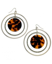 Let these orbital earrings from GUESS pull you in. They feature rings in hematite and gold tone mixed metal embellished with crystal accents. A chic brown tortoise circle pendant sits at the center. Approximate drop: 2-1/2 inches.