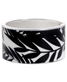 Infuse your look with the bold colors and exotic prints of Brasil. Crafted in silver tone mixed metal Haskell's Palm bangle features black and white palm leaf details and a hinge clasp. Approximate diameter: 2-1/2 inches. Approximate length: 8 inches. Item comes packaged in an orange gift box. Infuse your look with the bold colors and exotic prints of Brasil. Crafted in silver tone mixed metal Haskell's Palm bangle features black and white palm leaf details and a hinge clasp. Approximate diameter: 2-1/2 inches. Approximate length: 8 inches. Item comes packaged in an orange gift box.
