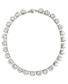 Simply stunning. Add glitz and glamour to your evening look with this chic collar necklace from Monet. Featuring a sparkling array of Swarovski crystals, it's crafted in silver tone mixed metal. Approximate length: 18 inches.