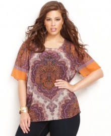 An exotic print lets bold hues stand out! INC's plus size top can be styled casually or dressed up depending on your mood.