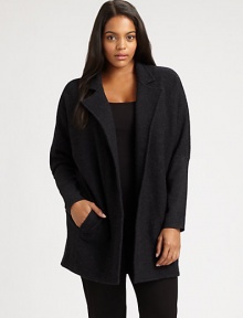 Whether worn over a sleek or relaxed-fit top, this boiled merino wool coat is sure to make a stylish first impression. Notched collarDolman sleevesWelt pocketsAbout 32 from shoulder to hemBody: merino woolSleeves: merino wool/nylon/spandexDry cleanImported