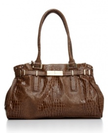 Elegant outside, functional within: the Victoria features croc embossing and triple interior compartments for a smart-chic look that's pure Ivanka Trump. Elegant outside, functional within: the Victoria features croc embossing and triple interior compartments for a smart-chic look that's pure Ivanka Trump.