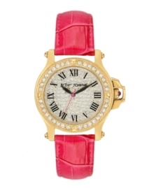 Glamour that packs a punch. Dare to wear this bold watch by Betsey Johnson. Pink croc-embossed leather strap and round gold tone stainless steel case. Bezel embellished with crystal accents. Crystal pave dial features black Roman numerals, black hour and minute hands, signature fuchsia second hand and logo. Quartz movement. Water resistant to 30 meters. Two-year limited warranty. Glamour that packs a punch. Dare to wear this bold watch by Betsey Johnson. Pink croc-embossed leather strap and round gold tone stainless steel case. Bezel embellished with crystal accents. Crystal pave dial features black Roman numerals, black hour and minute hands, signature fuchsia second hand and logo. Quartz movement. Water resistant to 30 meters. Two-year limited warranty.