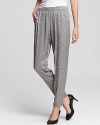 Embrace effortless glamour with these metallic Trina Turk pants, rendered in shimmering feather-print jacquard and offering an elegant tapered silhouette.