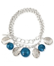 Eclectic elegance. Kenneth Cole New York's half stretch bracelet, crafted from silver-tone mixed metal, brings together blue glitter and faceted oval beads to stunning effect. Item comes packaged in a signature Kenneth Cole New York Gift Box. Approximate diameter: 2-1/2 inches.