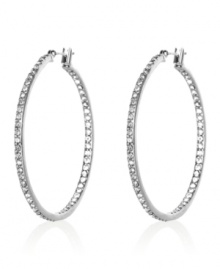 Highlight your look with a side of sparkle. These slim Monet hoop earrings are crafted in silvertone mixed metal and crystal accents. Approximate diameter: 1-3/4 inches.