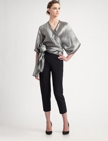 Metallic, silk blend, rendered in a wrap front kimono style with a dramatic, sculptural side tie.Surplice necklineWide three-quarter kimono sleevesWrap front with side tie74% viscose/26% silkDry cleanMade in Italy of imported fabricModel shown is 5'10 (177cm) wearing US size 4. 