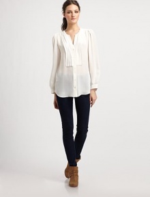 An elegant design cut from gorgeous silk georgette finished with delicate pleats at the bodice and shoulders.RoundneckButton frontGathered sleevesShirttail hemBack box pleatAbout 27 from shoulder to hemSilkDry cleanImportedModel shown is 5'9½ (176cm) wearing US size Small.