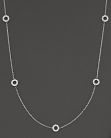 A delicate white gold chain with 5 double-sided white gold diamond circle stations.