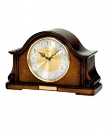 Mark the time with the pleasing chimes of this handsome mantel clock by Bulova. Solid wood and wood veneer case with Old World walnut finish houses two-tone metal dial with numerals and two black hands. Plays Westminster or Wittington chimes on the quarter hour and counts the hour. With adjustable volume control and night shut-off.