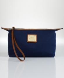 Store makeup essentials in travel-ready style with this easy-to-clean nylon pouch, complete with stylish interior twill lining and a convenient interior side pocket. Store makeup essentials in travel-ready style with this easy-to-clean nylon pouch, complete with stylish interior twill lining and a convenient interior side pocket.