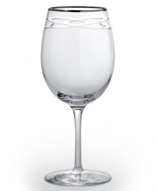 Commemorate a special anniversary with a simply elegant reminder of the time you said, I do. This radiant crystal wine glass is hand-engraved with interlocking bands that symbolize the rings exchanged between bride and groom. A platinum rim provides a graceful finish. Commemorate a special anniversary with a simply elegant reminder of the time you said, I do. This radiant crystal wine glass is hand-engraved with interlocking bands that symbolize the rings exchanged between bride and groom. A platinum rim provides a graceful finish.