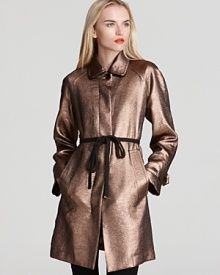 Bronze without the sun. This high-drama MARC BY MARC JACOBS coat takes the trench to haute levels this season with rich color, a covered placket and a matte tie belt.