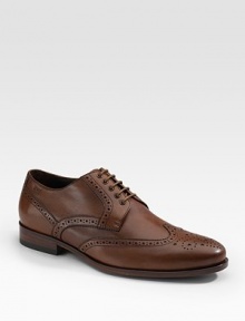 A heritage style for any gentleman of style, crafted in leather with brogue-style perforations. Debossed logo Padded insole Leather/rubber sole Imported 