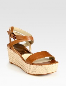 Adjustable leather criss-cross straps rest upon an espadrille wedge and platform. Wear them with a floaty sundress or tailored pants and a fitted tee. Braided hemp wedge, 2 (50mm)Braided hemp platform, 1 (25mm)Compares to a 1 heel (25mm)Leather upperLeather lining and solePadded insoleImported