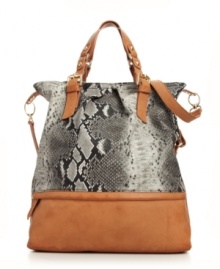 This spacious tote was made for the girl who doesn't travel light. A KDNY by Kelsi Dagger design featuring goldtone hardware, sleek contrast trim and convenient optional crossbody strap. This spacious tote was made for the girl who doesn't travel light. A KDNY by Kelsi Dagger design featuring goldtone hardware, sleek contrast trim and convenient optional crossbody strap.