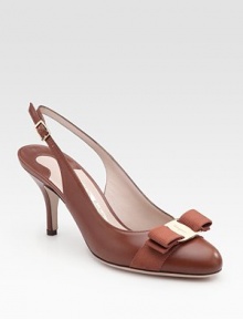 Lustrous leather pump with an elegant faille bow and adjustable slingback. Self-covered heel, 3 (75mm) Leather lining and sole Padded insole Made in Italy Lustrous leather pump with an elegant faille bow and adjustable slingback. Self-covered heel, 3 (75mm) Leather lining and sole Padded insole Made in Italy