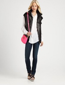 Plush leather meets a knit design in a sleeveless, funnelneck silhouette for a good girl gone bad vibe.FunnelneckSleevelessFull-zip frontFront flap pocketsSide slash pocketsAbout 26 from shoulder to hemLeather/WoolProfessional leather cleanerImportedSIZE & FITModel shown is 5'10 (177cm) wearing a US size Small.This style runs true to size. We recommend ordering your usual size for a standard fit. 