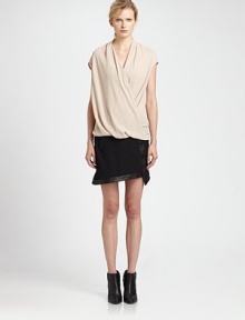 Sleek and structured, this mixed-media skirt has contrasting leather trim and asymmetrical details that create a warped-like effect. Zippered slash pocketFront crossover panelAsymmetrical hemBack zipperAbout 16 longBody: Viscose/elastane/ramieTrim: LeatherDry clean with leather specialistMade in USA of Italian fabricModel shown is 5'11 (178cm) wearing US size 4. Sleek and structured, this mixed-media skirt has contrasting leather trim and asymmetrical details that create a warped-like effect. Zippered slash pocketFront crossover panelAsymmetrical hemBack zipperAbout 16 longBody: Viscose/elastane/ramieTrim: LeatherDry clean with leather specialistMade in USA of Italian fabricModel shown is 5'11 (178cm) wearing US size 4.