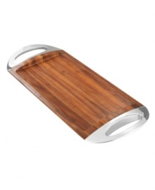 From afternoon tea to cocktail hour, the Grande tray caters every occasion with sophisticated Nambe style. Rich acacia wood with a raised edge to keep things steady is flanked by metal handles for luxurious shine. Designed by Will Oltman for Nambe's collection of serveware and serving dishes. From afternoon tea to cocktail hour, the Grande tray caters every occasion with sophisticated Nambe style. Rich acacia wood with a raised edge to keep things steady is flanked by metal handles for luxurious shine. Designed by Will Oltman for Nambe's collection of serveware and serving dishes.