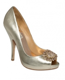 A sign of refinement. The Lissa evening pumps by Badgley Mischka make a stunning statement in metallic leather, topped with a sparkling, vintage-inspired brooch accent.