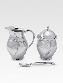 A handmade creamer and sugar set in hammered, sandcast aluminum, buffed by hand for unparalleled shine and elegance. Set includes sugar bowl with lid, creamer and matching spoon Creamer, 4½H X 3 diam. Sugar, 4½H X 3 diam. Spoon, 5 long Sandcast aluminum Food safe Hand wash Imported A handmade creamer and sugar set in hammered, sandcast aluminum, buffed by hand for unparalleled shine and elegance. Set includes sugar bowl with lid, creamer and matching spoon Creamer, 4½H X 3 diam. Sugar, 4½H X 3 diam. Spoon, 5 long Sandcast aluminum Food safe Hand wash Imported