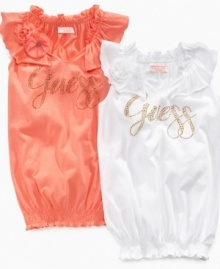 Feeling fancy. Dress up her casual wardrobe with this rhinestud accented, flounce-neck shirt from Guess. Feeling fancy. Dress up her casual wardrobe with this rhinestud accented, flounce-neck shirt from Guess.