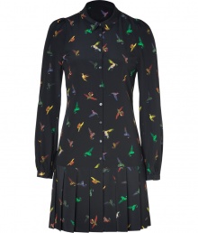 This pure silk shirtdress is a whimsical take on the classic button-down blouse - Features a rounded collar, long sleeves, buttoned cuffs, subtle puff at shoulder, full button placket, and feminine pleats in mini-length skirt - Allover colorful hummingbird print on soft black background - Wear to the office with textured stockings and platforms, or to lunch with tights and booties for an edgy daytime look