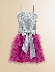 A dazzling frock, bejeweled with a sequined bodice, sash tie and sparkly ruffled skirt for a stunning ensemble.Straight necklineSleeveless with spaghetti strapsBack zipperWaistband with sashFull, tiered ruffle skirtFully linedPolyesterHand washMade in the USA of imported fabric A dazzling frock, bejeweled with a sequined bodice, sash tie and sparkly ruffled skirt for a stunning ensemble.Straight necklineSleeveless with spaghetti strapsBack zipperWaistband with sashFull, tiered ruffle skirtFully linedPolyesterHand washMade in the USA of imported fabric