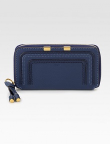 Luxurious leather with stitched details in a secure zip-around design.Zip-around closureStitched detailOne inside zip pocketTwo bill compartmentsTwelve credit card slotsCotton lining7½W X 4½H X ¾DMade in Italy Luxurious leather with stitched details in a secure zip-around design.Zip-around closureStitched detailOne inside zip pocketTwo bill compartmentsTwelve credit card slotsCotton lining7½W X 4½H X ¾DMade in Italy