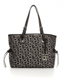 Signature style: Logo jacquard fabric makes this refined tote purse unmistakably Calvin Klein. Signature style: Logo jacquard fabric makes this refined tote purse unmistakably Calvin Klein.