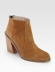 Ankle-grazing suede style with a wide, stacked heel, convenient back zipper and leather trim. Stacked heel, 3 (75mm)Suede upper with leather trimBack zipperLeather lining and solePadded insoleImportedOUR FIT MODEL RECOMMENDS ordering true whole size; ½ sizes should order the next whole size up. 