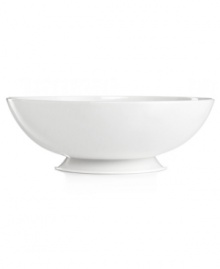 Keep it simple. In glossy white porcelain, this footed serving bowl is a flawless accompaniment to any dinnerware pattern and decor. From Martha Stewart Collection. Keep it simple. In glossy white porcelain, this footed serving bowl is a flawless accompaniment to any dinnerware pattern and decor. From Martha Stewart Collection.