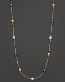 Tricolor, almond-shaped stations in gold and sterling silver shine on this modern necklace from Gurhan.