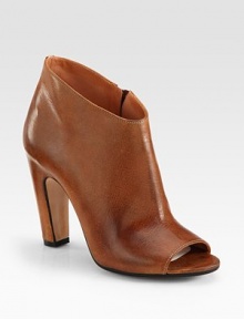 Exposed side zipper and an unanticipated peep toe modernize this burnished leather essential. Self-covered heel, 4 (100mm)Side zipperLeather upperLeather lining and solePadded insoleMade in ItalyOUR FIT MODEL RECOMMENDS ordering one size up as this style runs small. Exposed side zipper and an unanticipated peep toe modernize this burnished leather essential. Self-covered heel, 4 (100mm)Side zipperLeather upperLeather lining and solePadded insoleMade in ItalyOUR FIT MODEL RECOMMENDS ordering one size up as this style runs small.