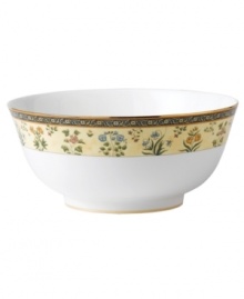 The exotic India dinnerware presents a pattern of exquisitely detailed florals on a yellow and deep blue band against pure white bone china. From Wedgwood's collection of salad bowls. The exotic India dinnerware presents a pattern of exquisitely detailed florals on a yellow and deep blue band against pure white bone china. From Wedgwood's collection of salad bowls.