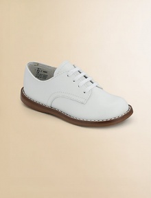 The timeless choice, expertly crafted in durable leather with excellent support and comfort.Leather upper Adjustable laces Padded insole Rubber traction sole Imported Please note: It is recommended that you order ½ size smaller than measured. If your child measures a size 7.0, you may want to order a 6½. The timeless choice, expertly crafted in durable leather with excellent support and comfort.Leather upper Adjustable laces Padded insole Rubber traction sole Imported Please note: It is recommended that you order ½ size smaller than measured. If your child measures a size 7.0, you may want to order a 6½.