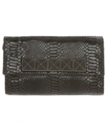 Shine bright all night with this glam goodie from MICHAEL Michael Kors. Croc-embossed leather and gleaming stud accents lend an exotic look, while the sleek shape tucks effortlessly under your arm. Shine bright all night with this glam goodie from MICHAEL Michael Kors. Croc-embossed leather and gleaming stud accents lend an exotic look, while the sleek shape tucks effortlessly under your arm.