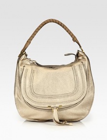 EXCLUSIVELY AT SAKS in Metallic Beige. A slouchy silhouette in frosted metallic calfskin leather, finished with a signature tennis-wrapped handle. Top handle, 8 dropTop zip closureHidden open pocket under flapOne inside zip pocketOne inside open pocketCotton lining15¾W X 15H X 5DMade in Italy EXCLUSIVELY AT SAKS in Metallic Beige. A slouchy silhouette in frosted metallic calfskin leather, finished with a signature tennis-wrapped handle. Top handle, 8 dropTop zip closureHidden open pocket under flapOne inside zip pocketOne inside open pocketCotton lining15¾W X 15H X 5DMade in Italy