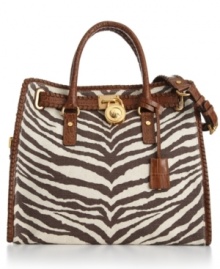 A wildly haute tote from MICHAEL Michael Kors. Eye-catching zebra printed canvas, polished goldtone hardware and intricate whip stitched accents add untamed appeal to this gorgeous bag. A wildly haute tote from MICHAEL Michael Kors. Eye-catching zebra printed canvas, polished goldtone hardware and intricate whip stitched accents add untamed appeal to this gorgeous bag.