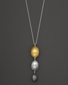 A modern tricolor pendant necklace in a mix of hammered sterling silver and 24K yellow gold. From Gurhan.