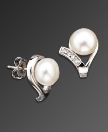 Perfect your style with sweet, sparkling studs. CRISLU earrings feature swirls of round-cut cubic zirconia (1/2 ct. t.w.) highlighting a polished freshwater pearl (8 mm). Set in platinum over sterling silver.