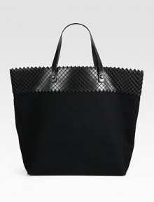 A roomy top handle silhouette of chic canvas edged with diamond-etched leather trim.Double top handles, 6 dropOne inside zip pocketOne inside open pocketCotton lining13W X 14½H X 6DMade in Italy A roomy top handle silhouette of chic canvas edged with diamond-etched leather trim.Double top handles, 6 dropOne inside zip pocketOne inside open pocketCotton lining13W X 14½H X 6DMade in Italy